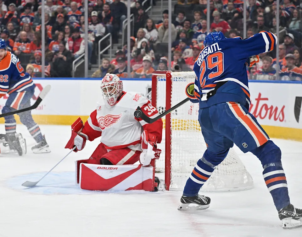 Detroit Red Wings goalie Cam Talbot (39) makes a stop on Edmonton Oilers center Leon Draisaitl (29) take on the Detroit Red Wings during the first period at Rogers Place in Edmonton, Alberta, on Thursday, Dec. 11, 2025.