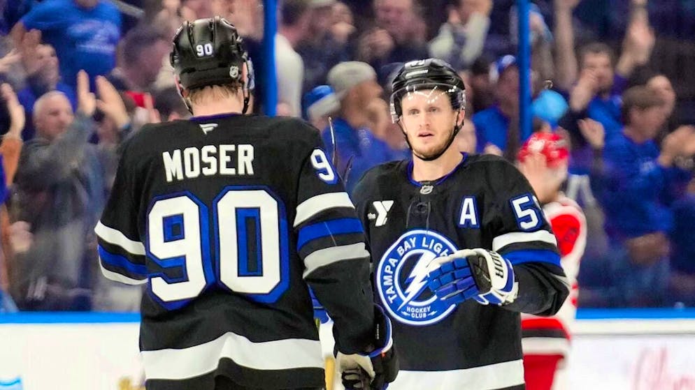 Janis Moser, here celebrating a goal with Jake Guentzel, signs with the Tampa Bay Lightning until the summer of 2034.