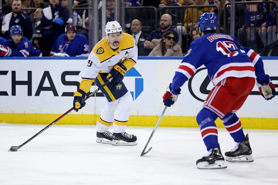 Mar 2, 2025; New York, New York, USA; Nashville Predators left wing Filip Forsberg (9) skates with the puck against New York Rangers defenseman Will Borgen (17) during the first period at Madison Square Garden. Mandatory Credit: Brad Penner-Imagn Images