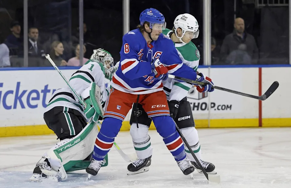 J.T. Miller battles for position with Ilya Lyubushkin during the Rangers’ OT win over the Stars on Dec. 2, 2025. Jason Szenes / New York Post