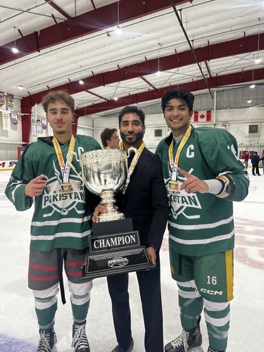 Co-captains Tariq Khan (left) and Zaakir Khan (right) flank coach Kameron Sabir as the trio celebrates Pakistan's Division III title at the 2025 LATAM Cup in Florida.
