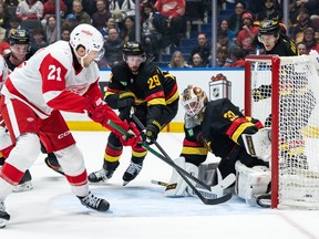 Detroit Red Wings' James van Riemsdyk (21) scores on Kevin Lankinen (32) as Marcus Pettersson (29) defends during the first period at Rogers Arena on Monday night