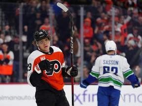 Philadelphia Flyers' Nikita Grebenkin, left, celebrates after scoring during the second period