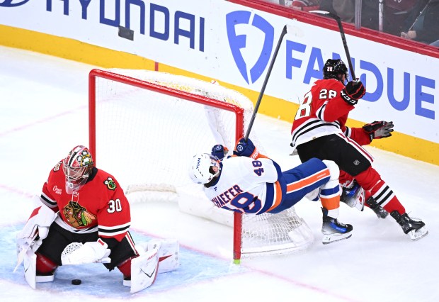 Matthew Schaefer of the New York Islanders collides with the goalpost against the Chicago Blackhawks during the third period at the United Center on Dec. 30, 2025, in Chicago. (Bobby Goddin/Getty Images)