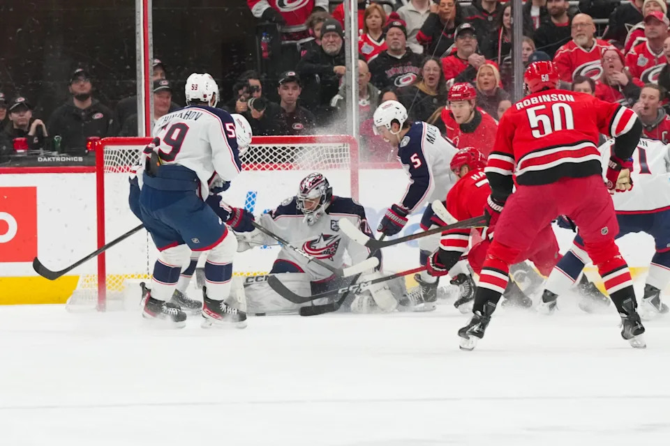 Dec 9, 2025; Raleigh, North Carolina, USA; aCarolina Hurricanes left wing Taylor Hall (71) shot is stopped by Columbus Blue Jackets goaltender Jet Greaves (73) during the second period t Lenovo Center. Mandatory Credit: James Guillory-Imagn Images