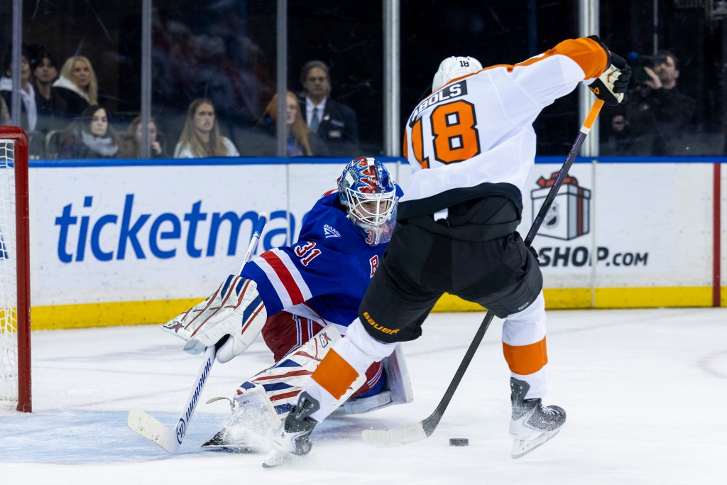 New York Rangers goaltender Igor Shesterkin defends the net against Philadelphia Flyers center Rodrigo Abols.