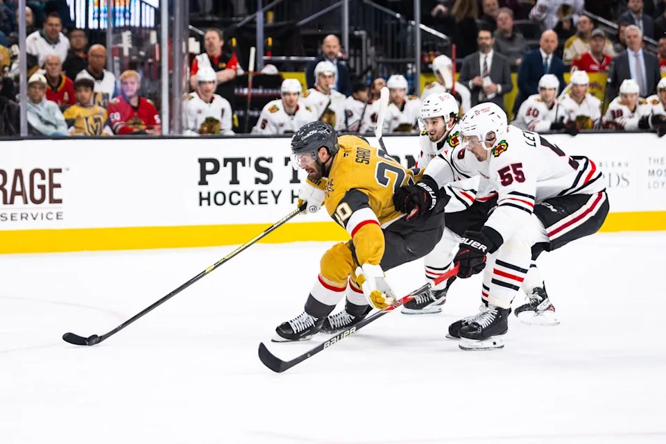Vegas Golden Knights left-wing Brandon Saad (20) skates towards the net as two Chicago Blackhawks players trail him during a NHL game between the Vegas Golden Knights and the Chicago Blackhawks, Tuesday December 2, 2025 in Las Vegas, Nev.
