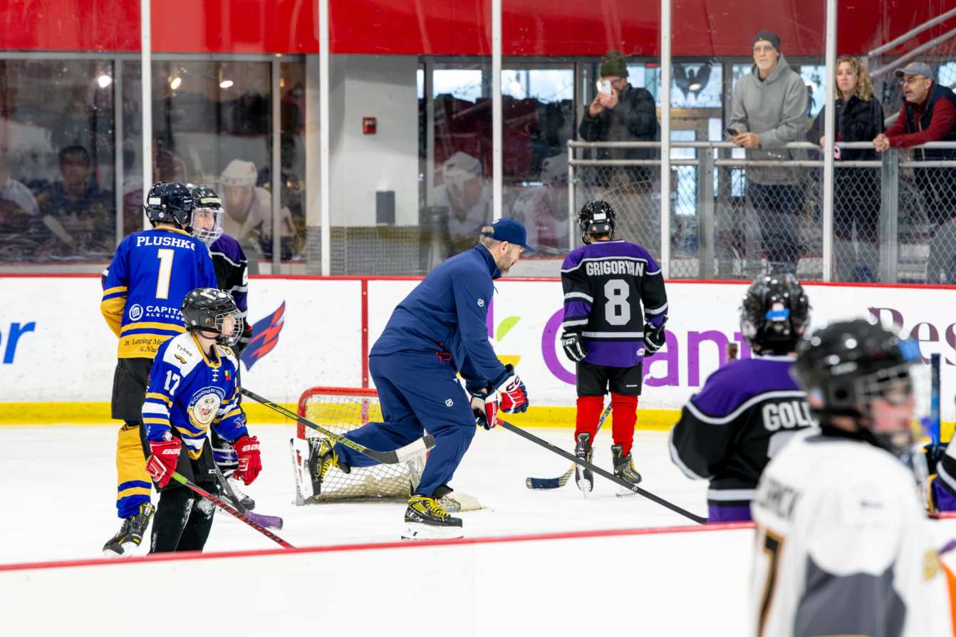 Alex Ovechkin skates with young players at the American Special Hockey Association clinic