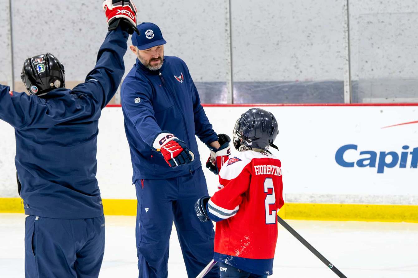Alex Ovechkin gives a fist bump at the American Special Hockey Association clinic