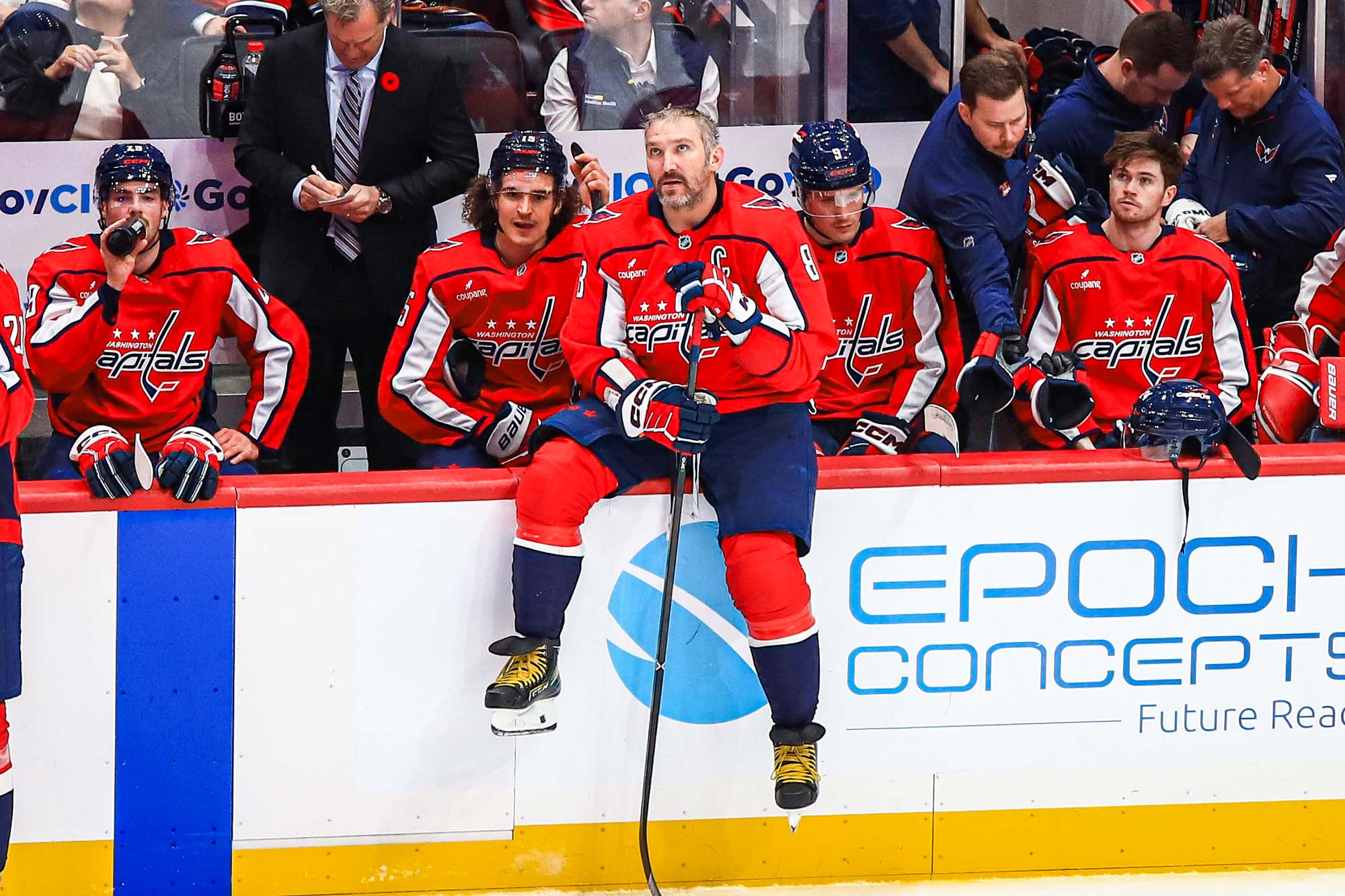 Alex Ovechkin sits on bench while watching highlight video