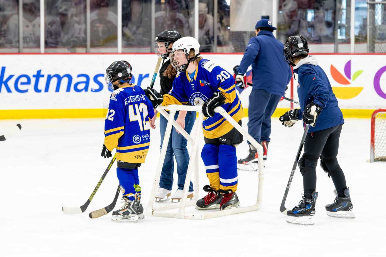 Players skate at the American Special Hockey Association clinic