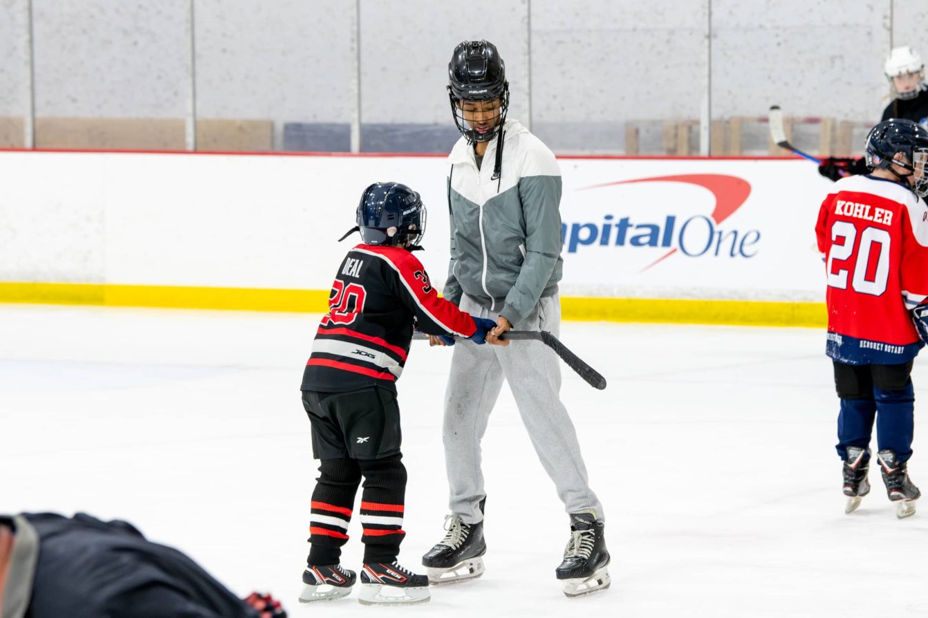 Players skate at the American Special Hockey Association clinic