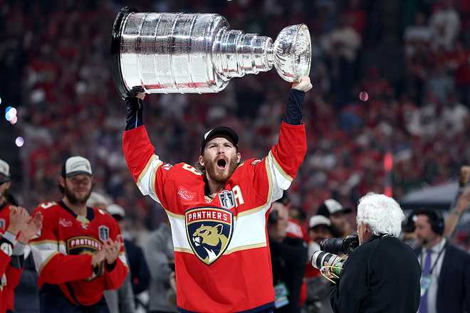 SUNRISE, FLORIDA - JUNE 17: Matthew Tkachuk #19 of the Florida Panthers celebrates with the Stanley Cup after defeating the Edmonton Oilers in Game Six of the 2025 Stanley Cup Final at Amerant Bank Arena on June 17, 2025 in Sunrise, Florida. (Photo by Christian Petersen/Getty Images)
