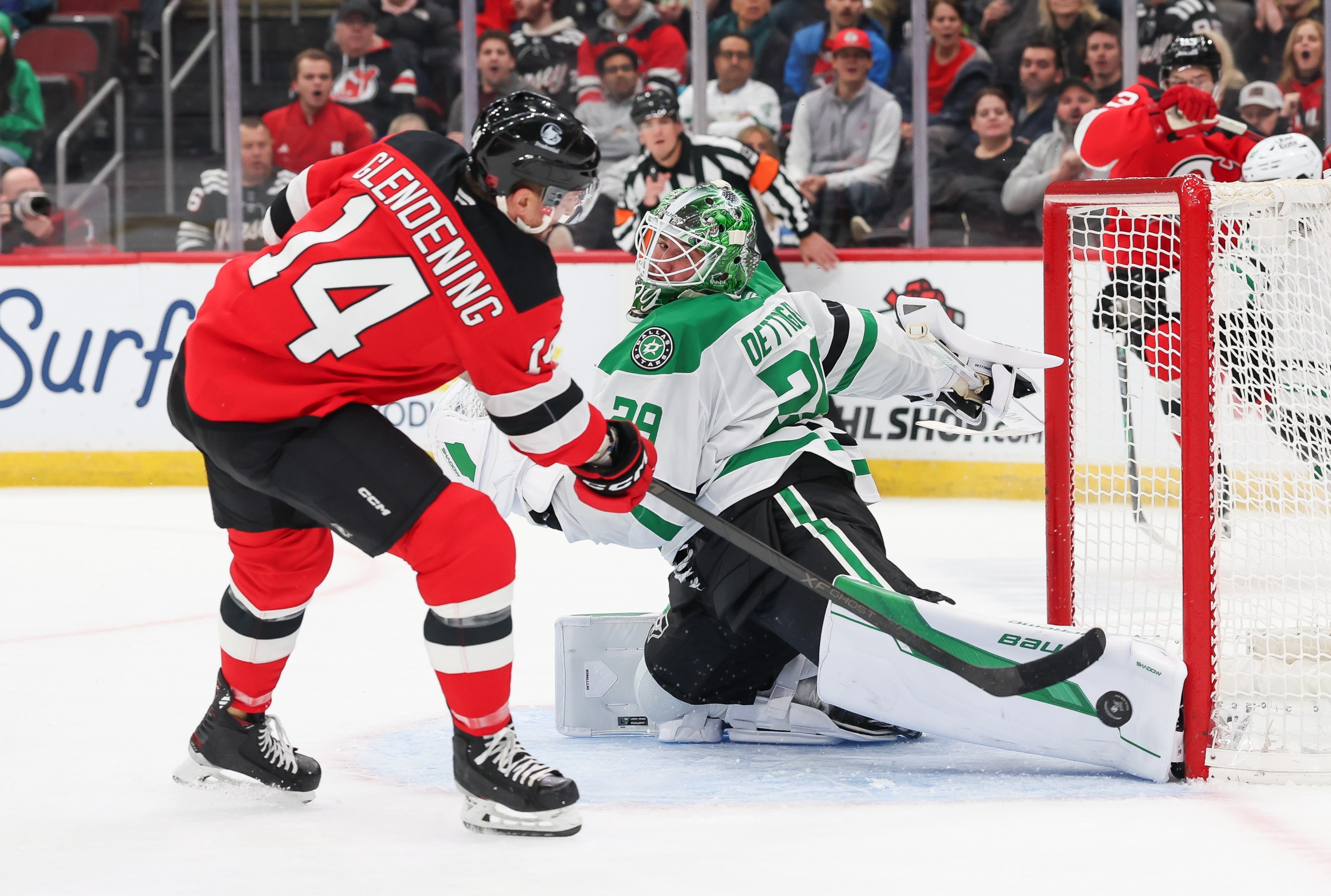 NEWARK, NJ - DECEMBER 03: Jake Oettinger #29 of the Dallas Stars makes a save on Luke Glendening #14 of the New Jersey Devils during a game between the Dallas Stars and New Jersey Devils at Prudential Center on December 3, 2025 in Newark, New Jersey. (Photo by Andrew Mordzynski/Icon Sportswire via Getty Images)