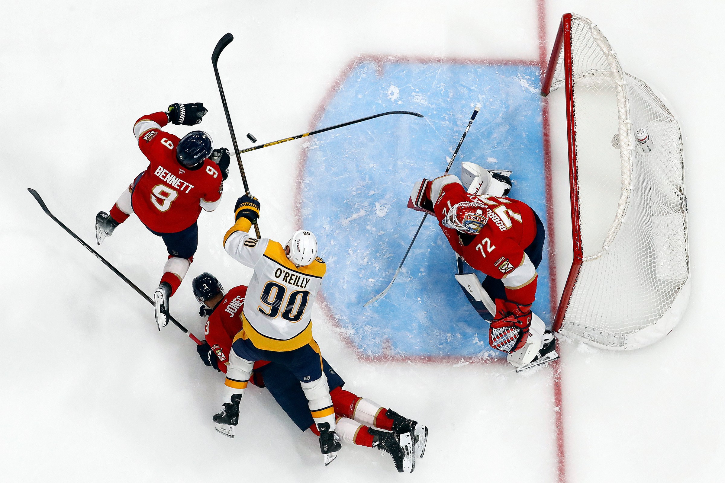SUNRISE, FLORIDA - DECEMBER 4: Goaltender Sergei Bobrovsky #72 of the Florida Panthers defends the net with the help of teammates Sam Bennett #9 and Seth Jones #3 against Ryan O’Reilly #90 of the Nashville Predators at the Amerant Bank Arena on December 4, 2025 in Sunrise, Florida. (Photo by Eliot J. Schechter/NHLI via Getty Images)