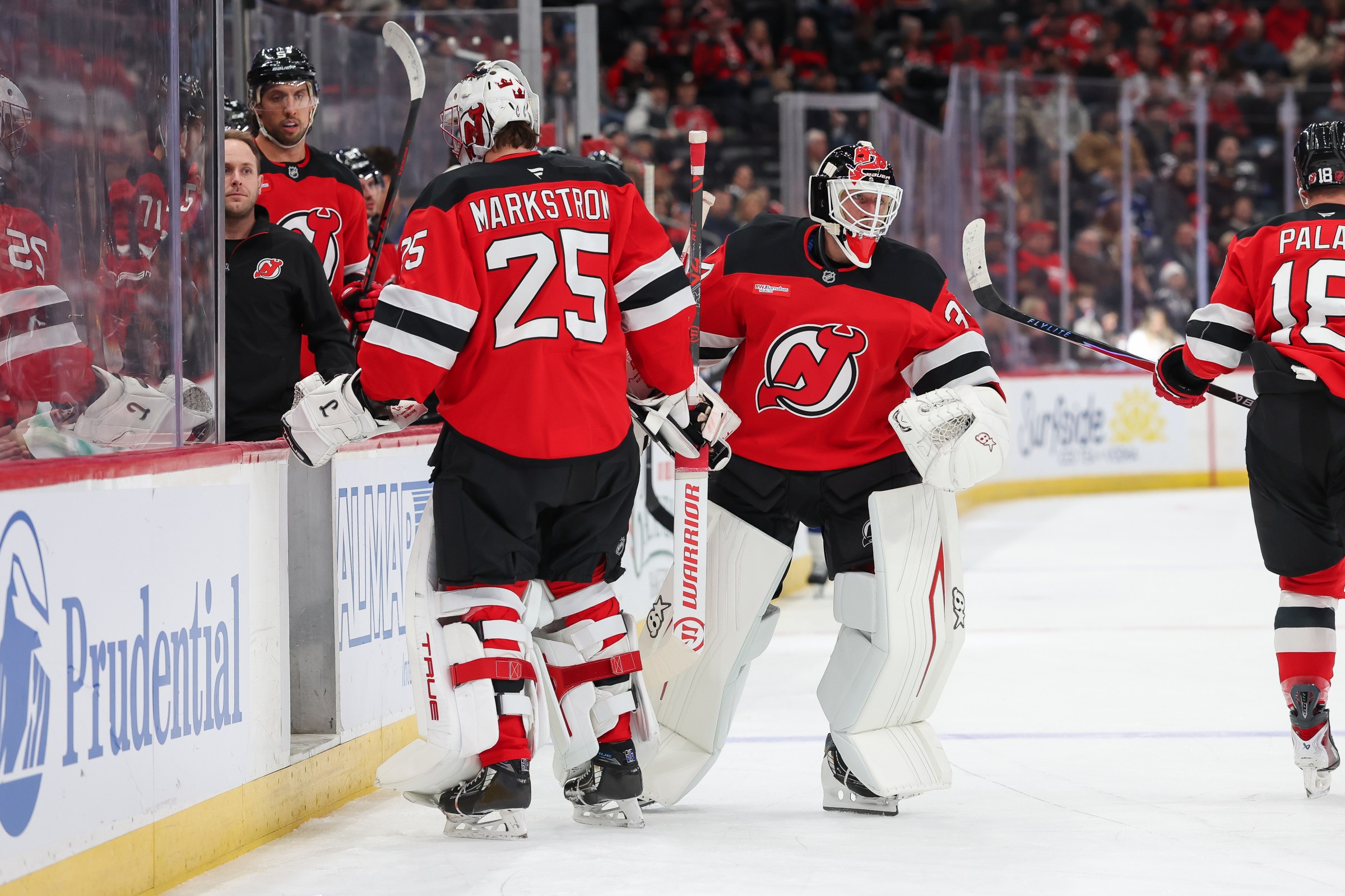 NEWARK, NEW JERSEY - DECEMBER 11: Jacob Markstrom #25 of the New Jersey Devils skates to the bench to be replaced by Jake Allen #34 of the New Jersey Devils during the first period of a NHL game against the Tampa Bay Lightning at Prudential Center on December 11, 2025 in Newark, New Jersey. (Photo by Andrew Mordzynski/Getty Images)