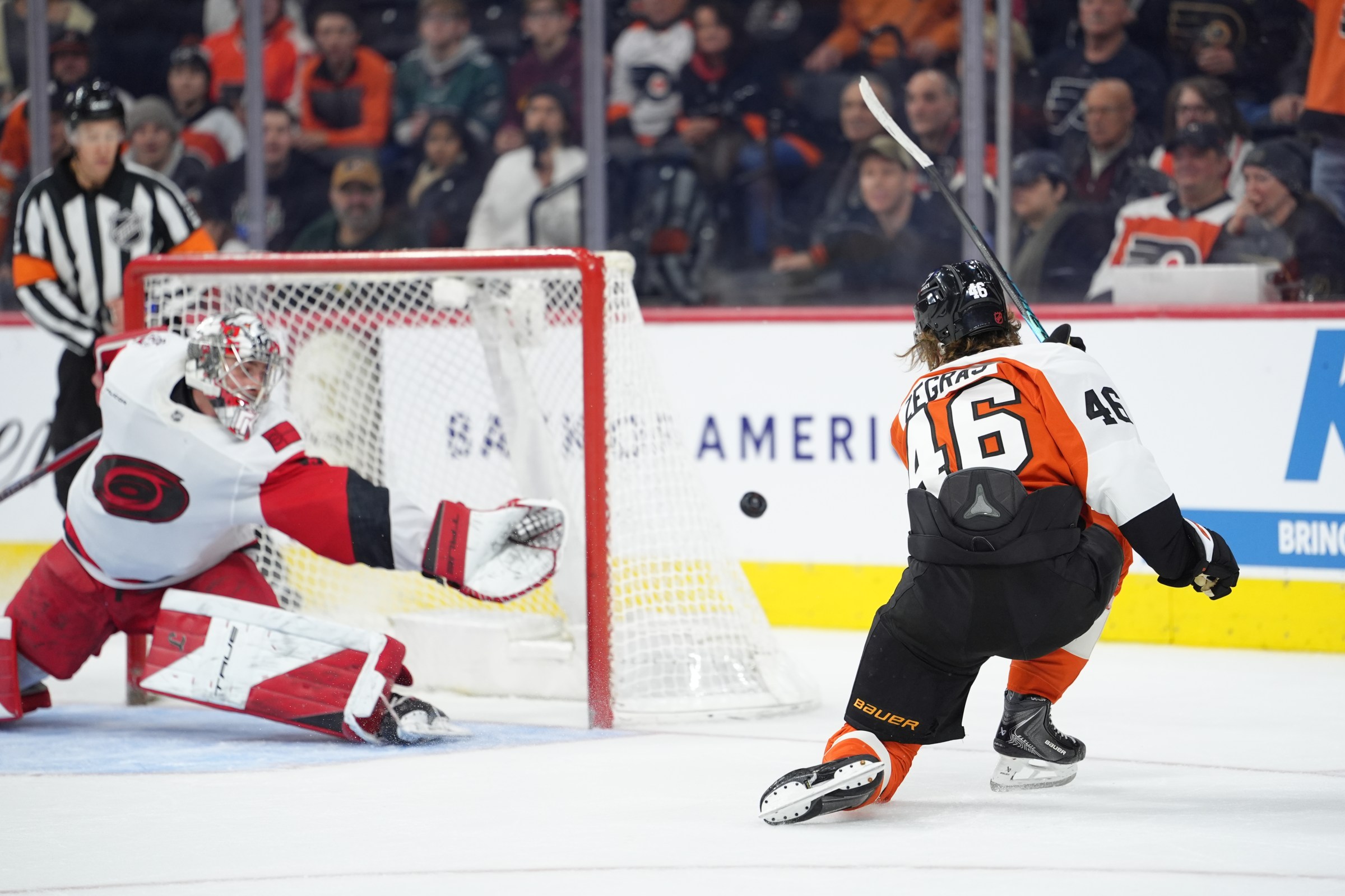 Dec 13, 2025; Philadelphia, Pennsylvania, USA; Philadelphia Flyers center Trevor Zegras (46) shoots the puck against Carolina Hurricanes goaltender Pyotr Kochetkov (52) in overtime at Xfinity Mobile Arena. Mandatory Credit: Kyle Ross-Imagn Images