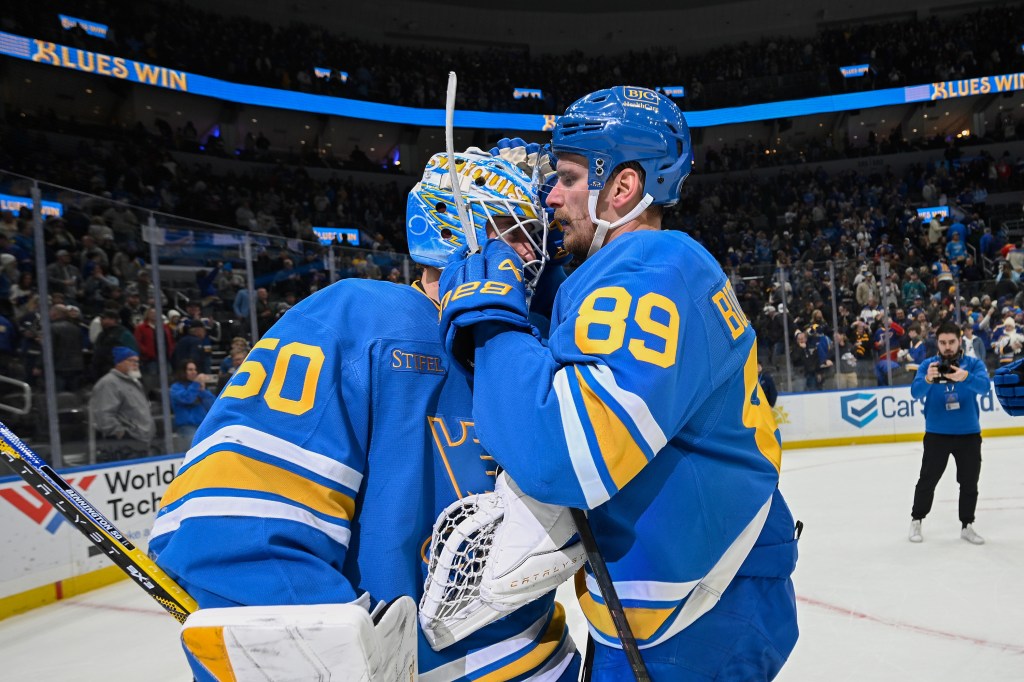 Jordan Binnington and Pavel Buchnevich of the St. Louis Blues celebrate their victory.