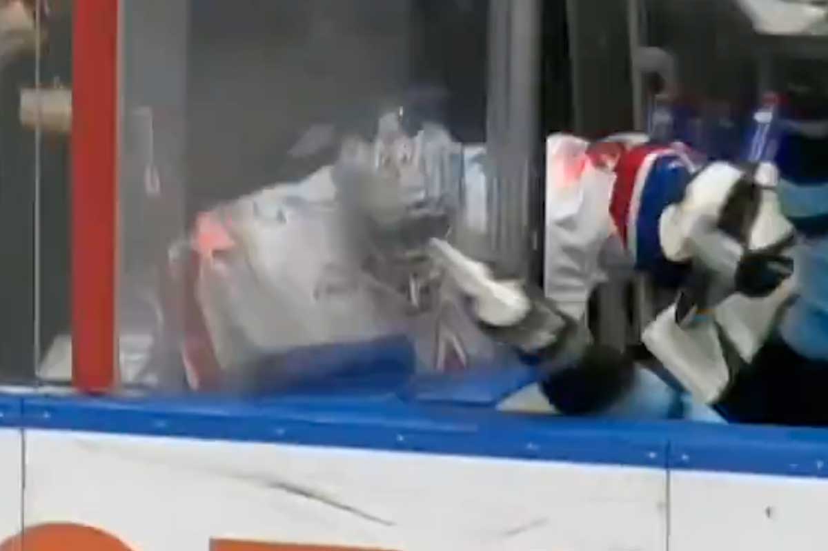 Insane chain-reaction hit in KHL sees player checked into bench send backup goaltender through the glass