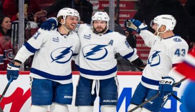 Tampa Bay Lightning's Charle-Edouard D'Astous (51) celebrates his goal with teammates Nikita Kucherov (86) and Darren Raddysh (43) during second period NHL hockey action against the Montreal Canadiens in Montreal on Tuesday, Dec. 9, 2025. (Christopher Katsarov/The Canadian Press via AP)