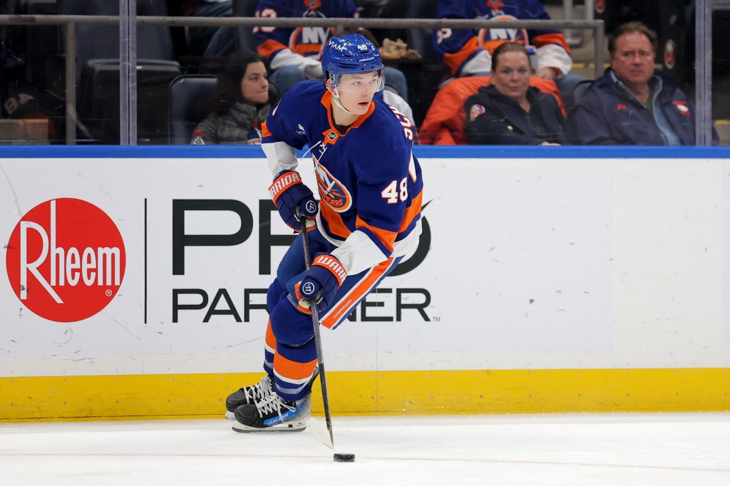 New York Islanders defenseman Matthew Schaefer (48) skates with the puck.