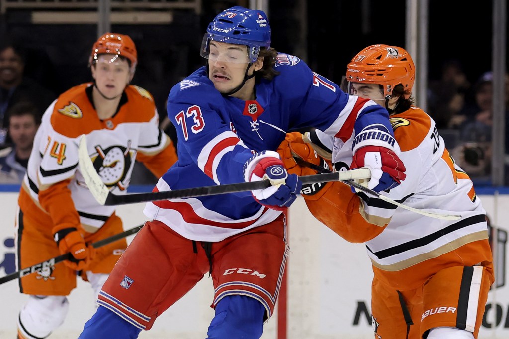 New York Rangers center Matt Rempe (73) hits Anaheim Ducks defenseman Olen Zellweger (51) during the first period at Madison Square Garden. 