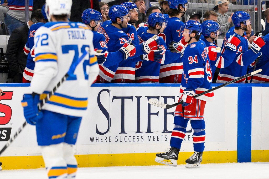 New York Rangers right wing Gabe Perreault (94) is congratulated by teammates after scoring his first NHL goal against the St. Louis Blues.