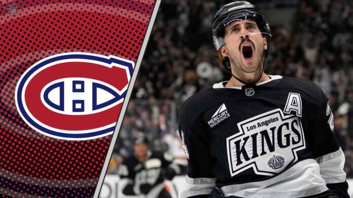 Los Angeles Kings center Phillip Danault skating during a game, subject of recent NHL trade rumors regarding a potential move to Montreal or New Jersey.