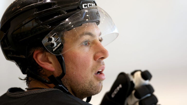 Charlie McAvoy watches his teammates skate during Bruins captains’ practice at Warrior Ice Arena on Tuesday, September 2, 2025.