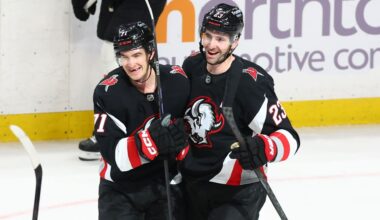 Buffalo Sabres center Ryan McLeod, left, celebrates his empty net goal with defenseman Mattias Samuelsson (23). (AP Photo/Jeffrey T. Barnes)