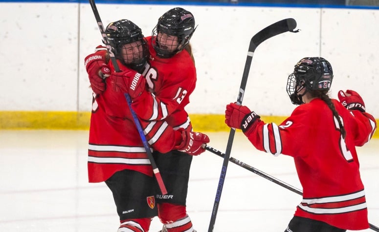 Tess Mulkerron (left), Erin Flaherty (middle) and Maggie Berleth (right) celebrate in St. Paul's upset of Williston in the 2023 Harrington. (Patrick Donnelly/NEHJ)