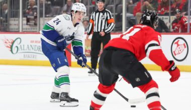 Buium has goal, assist in debut, Canucks edge Devils