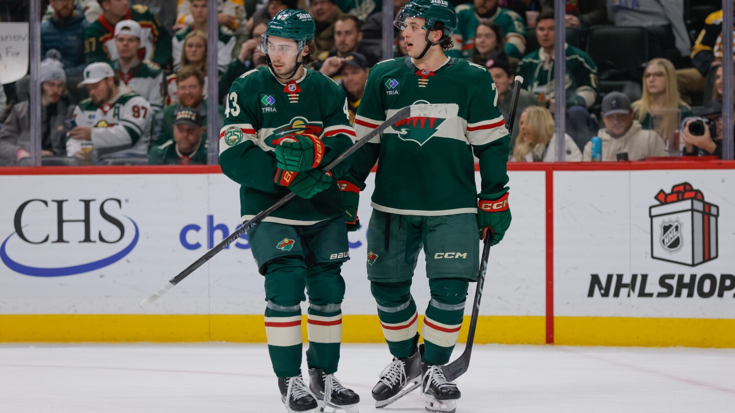 Quinn Hughes scores in Minnesota debut as Wild beat Bruins 6-2 for 4th straight win