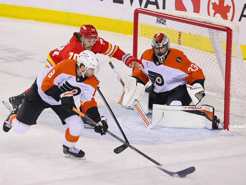  Calgary Flames forward Ryan Lomberg chases Philadelphia Flyers defenceman Cam York during NHL action at the Scotiabank Saddledome in Calgary on Wednesday December 31, 2025.Gavin Young/Postmedia