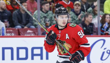 Nov 18, 2025; Chicago, Illinois, USA; Chicago Blackhawks center Connor Bedard (98) looks on during the second period of an NHL game against the Calgary Flames at United Center. Mandatory Credit: Kamil Krzaczynski-Imagn Images