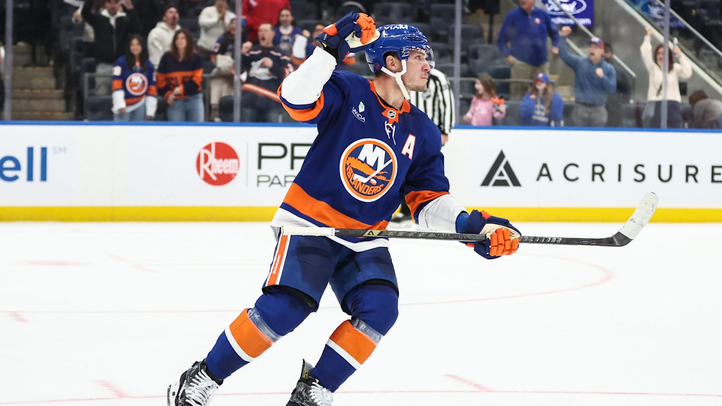 Nov 23, 2025; Elmont, New York, USA;  New York Islanders center Bo Horvat (14) celebrates after scoring a goal during a shootout in overtime against the Seattle Kraken at UBS Arena. Mandatory Credit: Wendell Cruz-Imagn Images