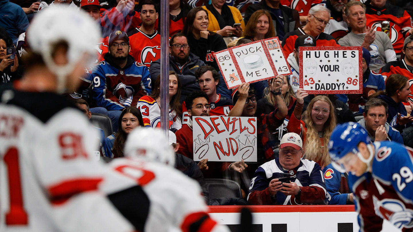 Feb 26, 2025; Denver, Colorado, USA; New Jersey Devils fans hold up signs in the second period against the Colorado Avalanche at Ball Arena. Mandatory Credit: Isaiah J. Downing-Imagn Images