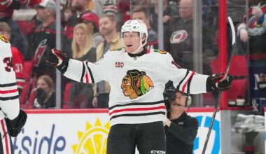 Jan 22, 2026; Raleigh, North Carolina, USA;  Chicago Blackhawks center Oliver Moore (11) scores the game winner in overtime against the Carolina Hurricanes at Lenovo Center. Mandatory Credit: James Guillory-Imagn Images