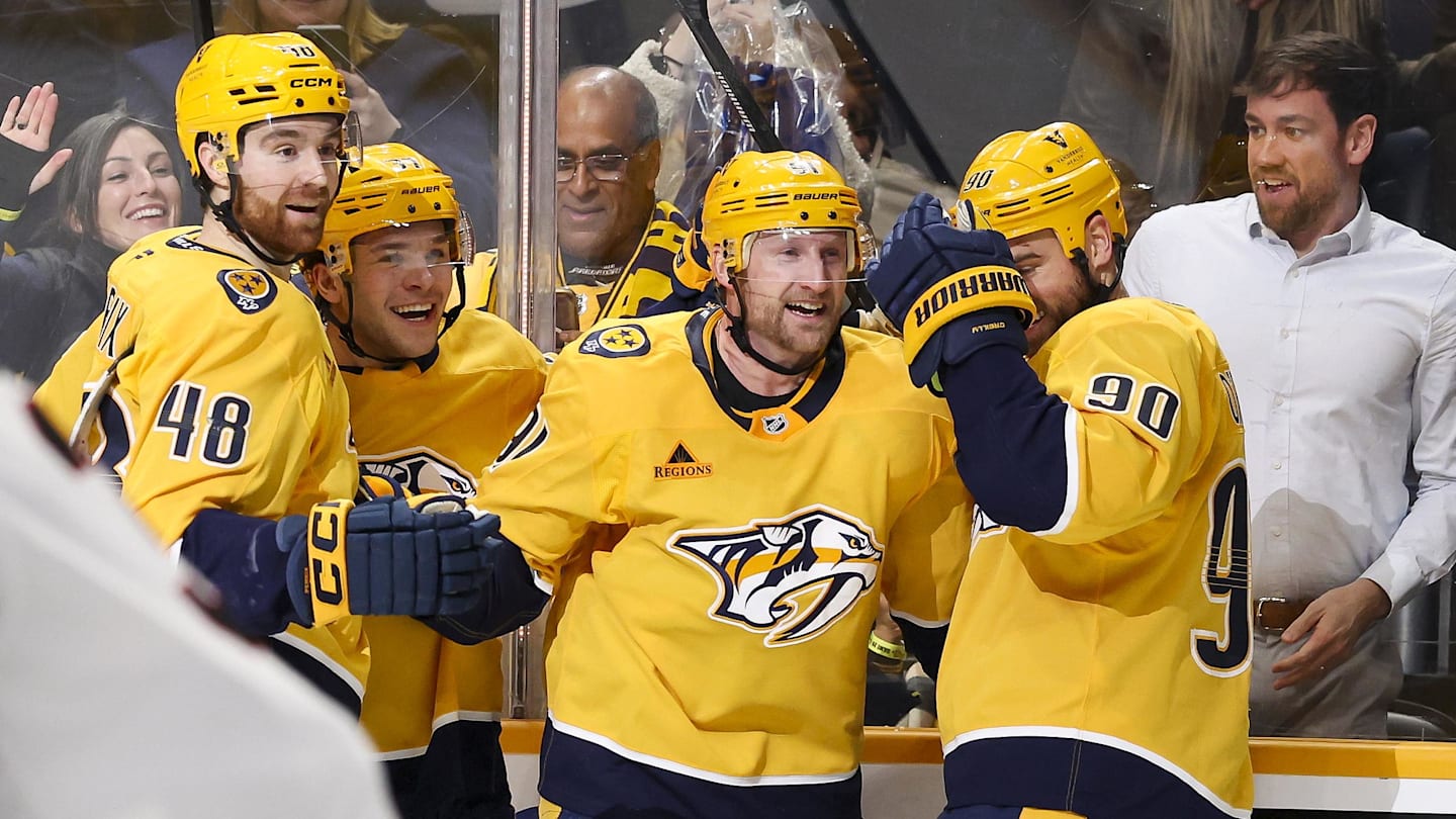 Jan 22, 2026; Nashville, Tennessee, USA;  Nashville Predators center Steven Stamkos (91) celebrates with teammates after scoring a goal and a hat trick against the Ottawa Senators during the third period at Bridgestone Arena. Mandatory Credit: Steve Roberts-Imagn Images