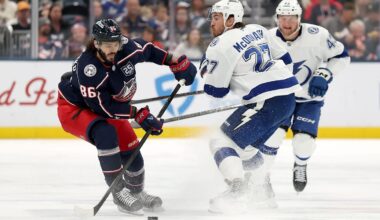 Blue Jackets forward Kirill Marchenko makes a move past Lightning defenseman Ryan McDonagh.
