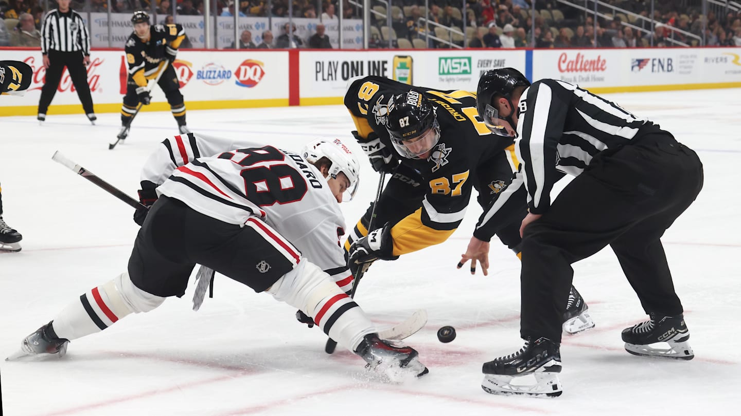 Apr 8, 2025; Pittsburgh, Pennsylvania, USA;  Chicago Blackhawks center Connor Bedard (98) and Pittsburgh Penguins center Sidney Crosby (87) take a third period face-off at PPG Paints Arena. Mandatory Credit: Charles LeClaire-Imagn Images