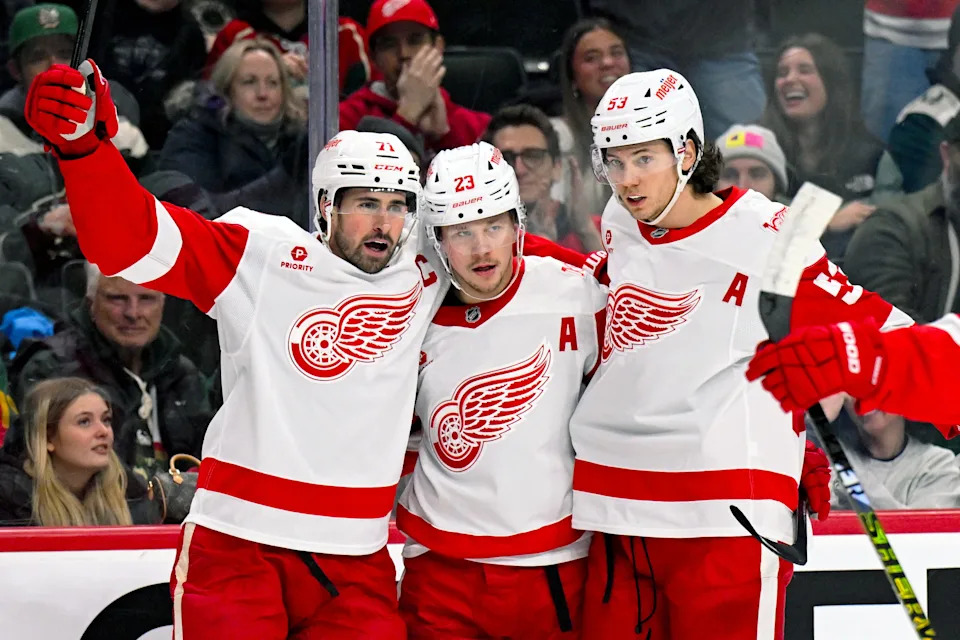 Detroit Red Wings forward Lucas Raymond (23) celebrates his power play goal against the Minnesota Wild with forward Dylan Larkin (71) and defensemen Moritz Seider (53) during the first period at Grand Casino Arena in St. Paul, Minnesota, on Thursday, Jan. 22, 2026.