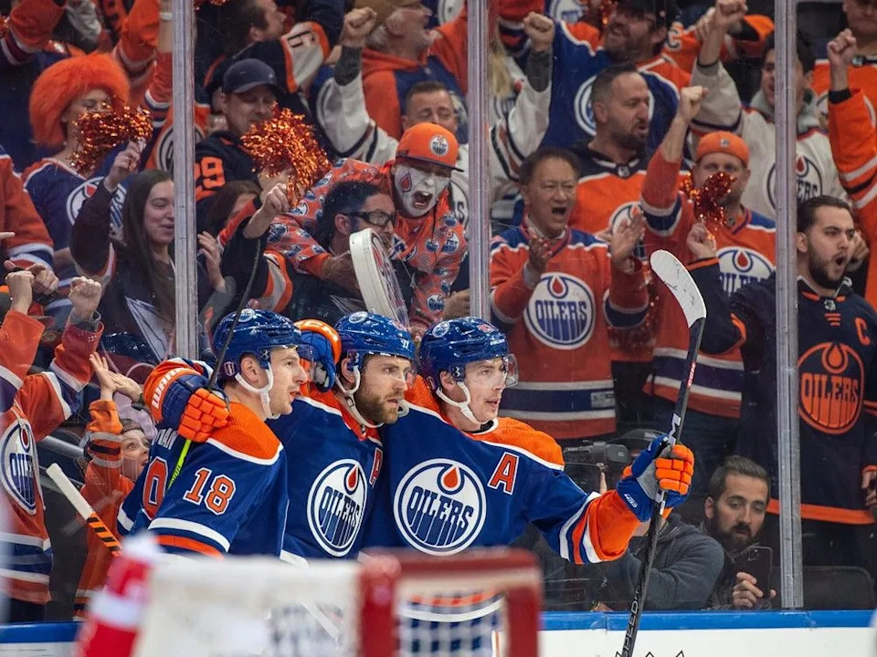Zach Hyman (18), Leon Draisaitl (29) and Ryan Nugent-Hopkins (93) of the Edmonton Oilers, celebrate the second Oilers goal in the first period against the Los Angeles Kings at Rogers Place in Edmonton on April 19, 2023.