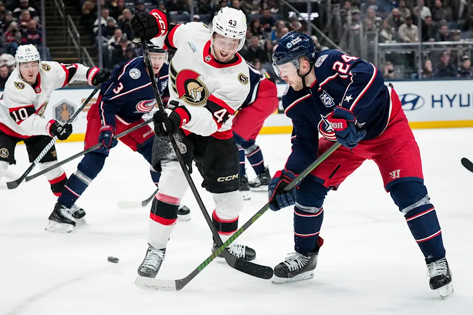 Columbus Blue Jackets right wing Mathieu Olivier (24) backhands a pass around Ottawa Senators defenseman Tyler Kleven (43) during the first period of the NHL hockey game at Nationwide Arena in Columbus on Jan. 20, 2026.