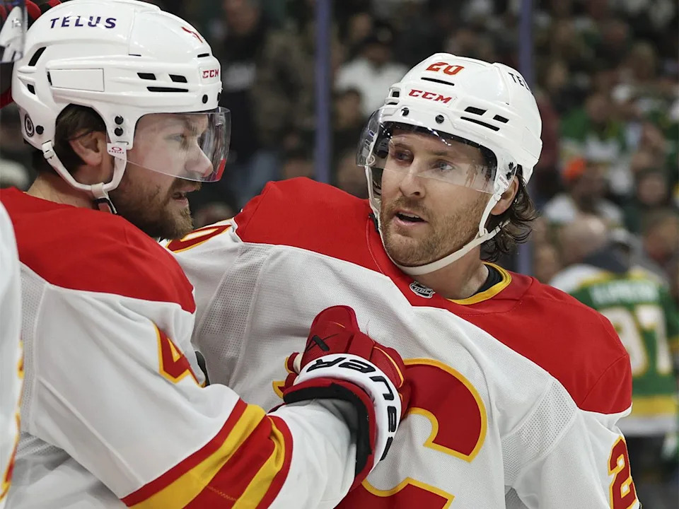  Calgary Flames defenceman Rasmus Andersson and forward Blake Coleman celebrate a goal during the second period of an NHL game against the Minnesota Wild on Saturday, Jan. 25, 2025, in St. Paul, Minn.