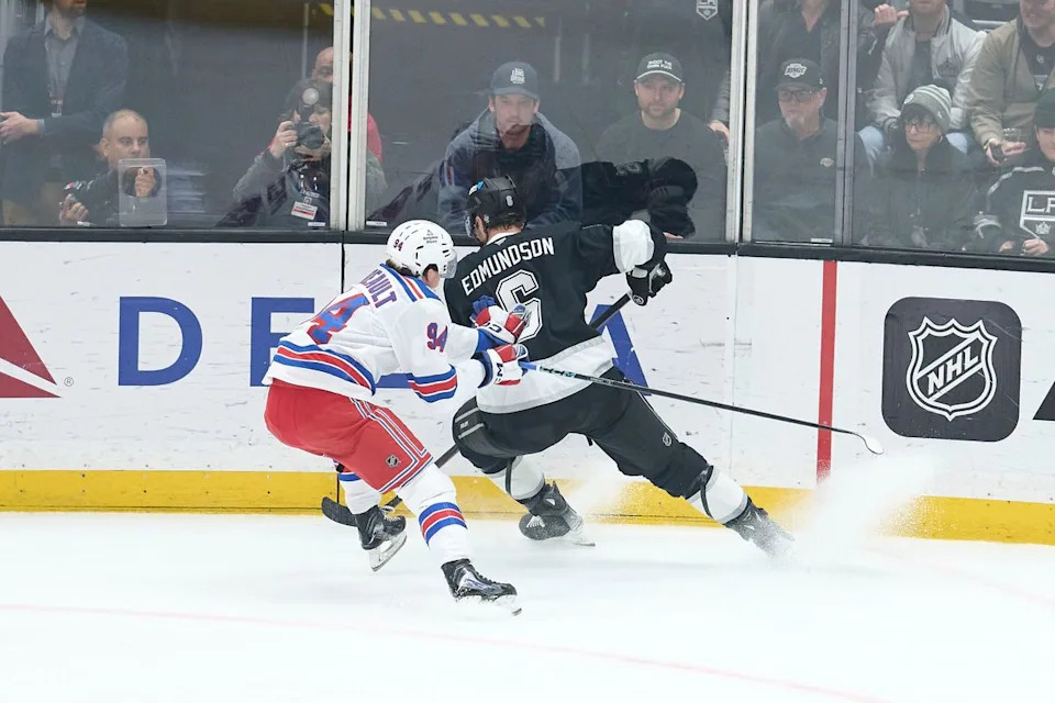 The Los Angeles Kings defender Joel Edmundson (6) gains possession against the New York Rangers at the Crypto Arena on January 20th, 2026 in Los Angeles California.