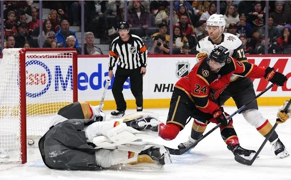  The Ottawa Senators’ Dylan Cozens watches his shot go in the net behind Vegas Golden Knights goaltender Adin Hill as Ben Hutton defends during the second period in Ottawa on Sunday, Jan. 25, 2026.