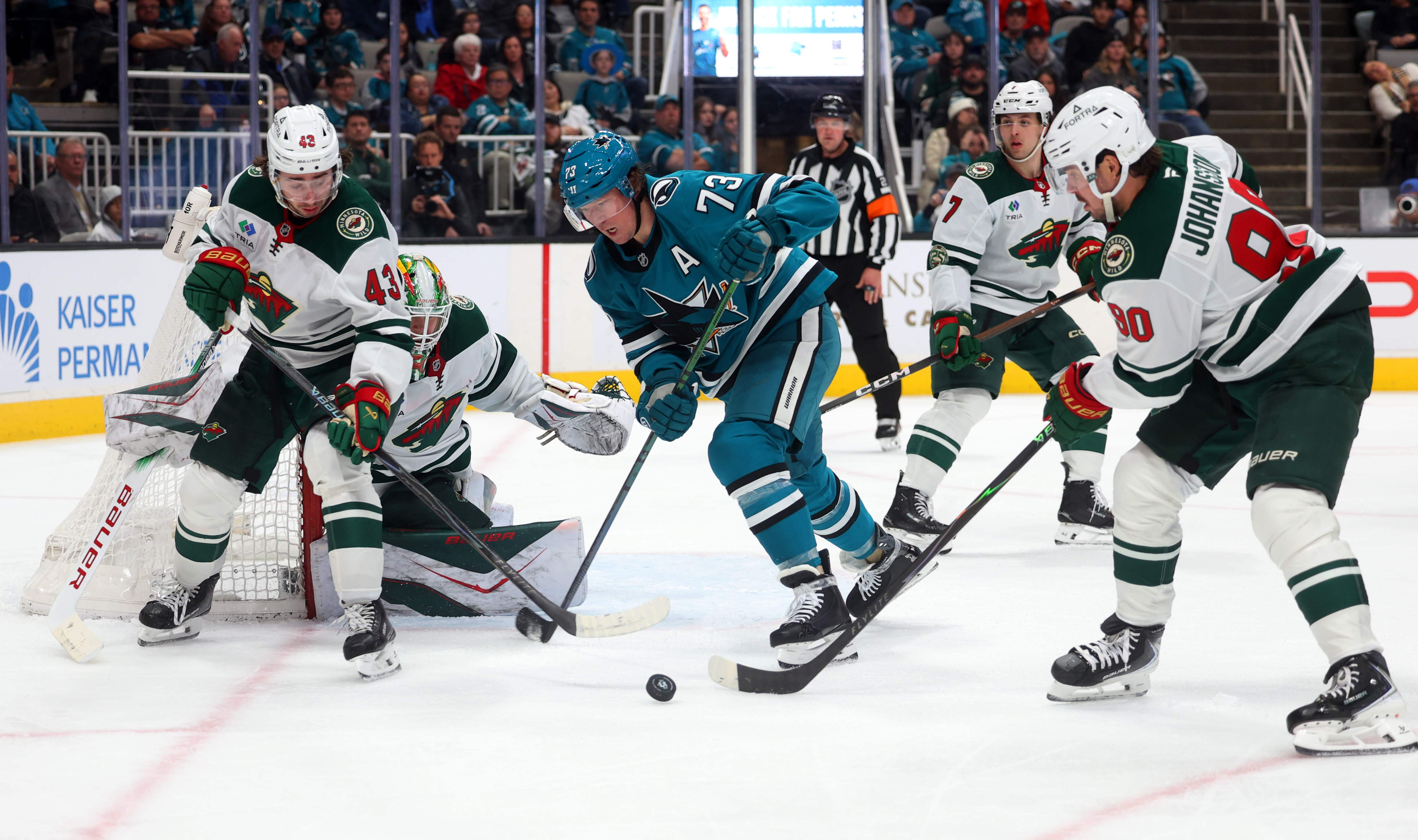 San Jose Sharks forward Tyler Toffoli (73) battles Minnesota Wild...