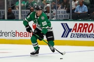 Dallas Stars defenseman Thomas Harley (55) looks to pass during the first period of an NHL...
