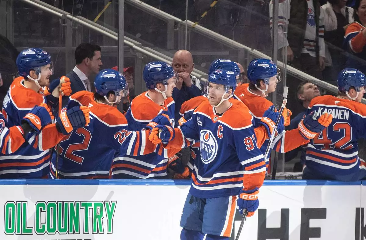 Edmonton Oilers' Connor McDavid (97) celebrates a goal against the Nashville Predators during first period NHL action, in Edmonton on Tuesday, Jan. 6, 2026. (Jason Franson/The Canadian Press via AP)